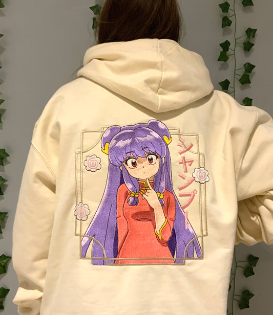 Sweatshirt à capuche brodé « shampoo «